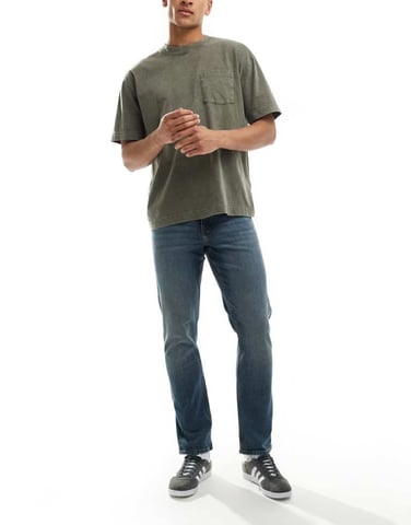 ASOS DESIGN slim fit jeans in mid wash blue