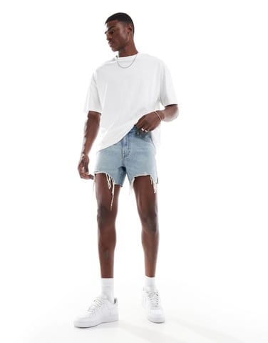 ASOS DESIGN shorter length slim denim shorts in light wash blue with rip detail