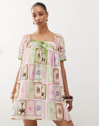 Reclaimed Vintage mini smock dress in bright postcard print with contrast trim