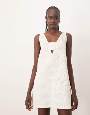 ARRANGE wave textured plunge mini dress in white
