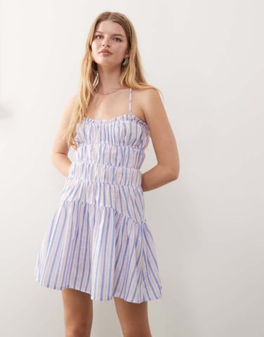 Reclaimed Vintage mini sun dress with ruching and cross back detail in purple stripe