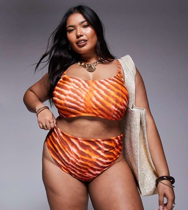 ASOS DESIGN Curve Charlie high waist bikini bottom in orange animal print
