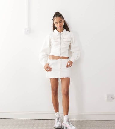 COLLUSION raw hem denim mini skirt in ecru