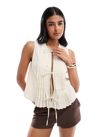 Pieces pleat detail tie front vest in cream