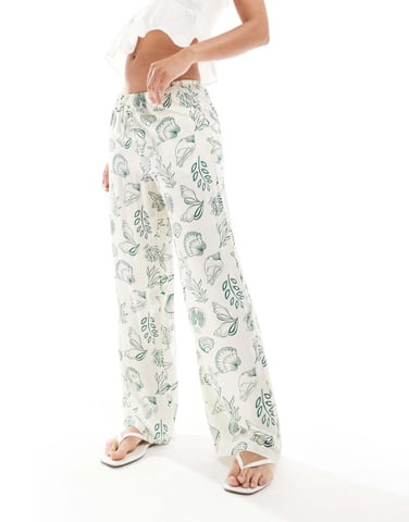 Vero Moda Easy tie waist wide leg trousers in conversational sea print
