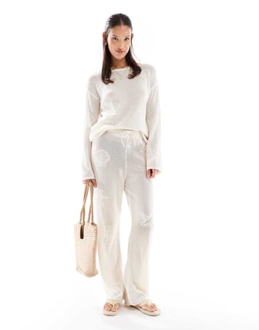 ASOS DESIGN lace knit wide leg trouser with shell motif in ecru
