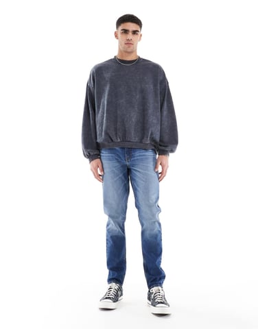 ASOS DESIGN skinny jeans with tint in mid wash blue