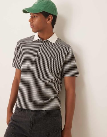 ASOS DESIGN boxy avslappnad polo i kräm och svart texturrand med broderi på bröstet