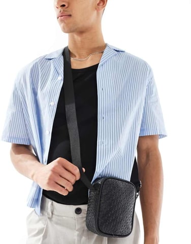 ASOS DESIGN faux leather embossed cross body bag in black