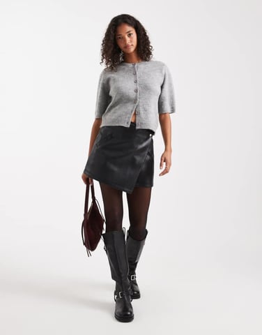 ASOS DESIGN faux leather asymmetric wrap mini skirt in black