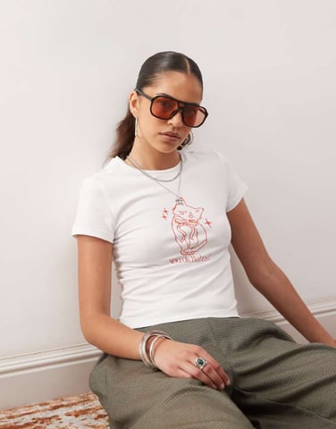 Noisy May baby tee with cat graphic in white