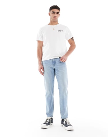 ASOS DESIGN tapered jeans i vintage ljusblå tvätt
