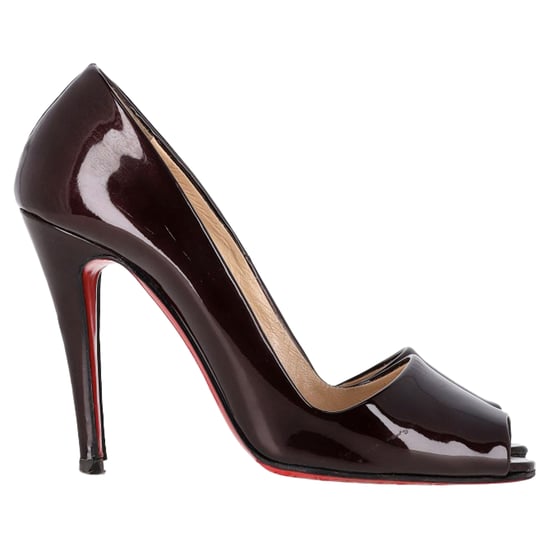 Christian Louboutin Peep-Toe Pumps in Dark Purple Patent Leather - Image 1