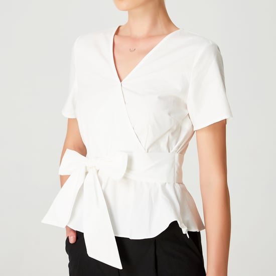 Peplum top with wide bow belt