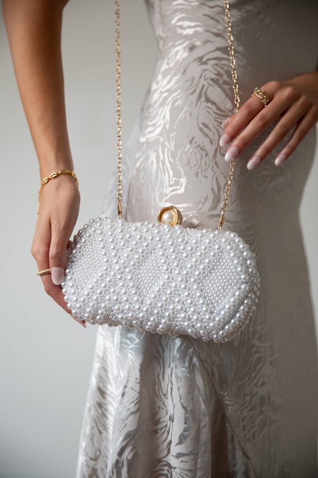 White beaded clutch bag