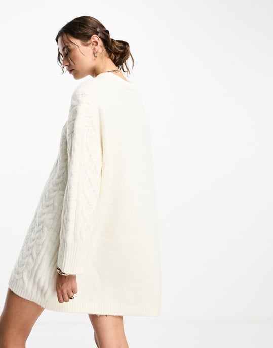 ASOS DESIGN knitted oversized cable mini jumper dress in cream-White