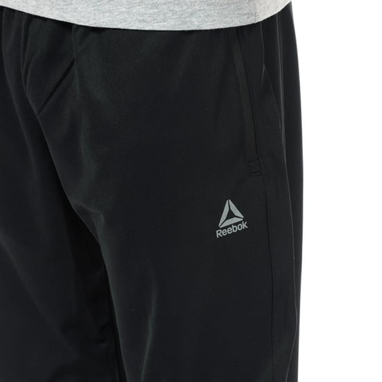 Men's Reebok Stacked Logo Trackster Pants in Black - Image 5
