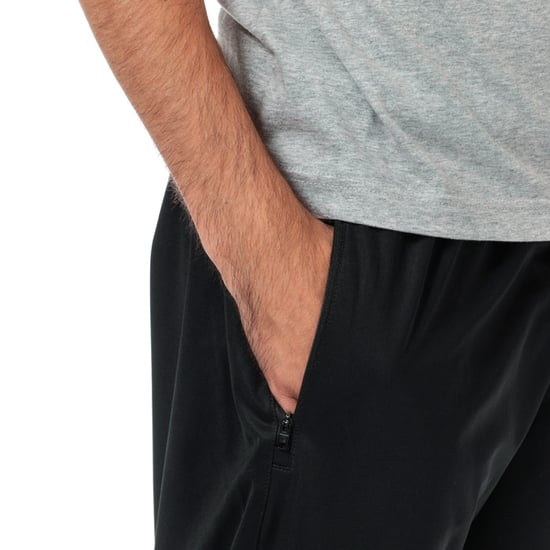 Men's Reebok Stacked Logo Trackster Pants in Black - Image 6