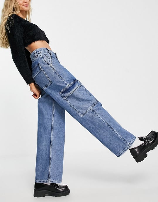 ASOS DESIGN cotton blend low rise 'cargo' jean in mid wash blue
