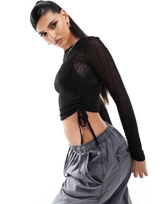 ASOS DESIGN sheer textured long sleeve ruched side top in black - Image 4