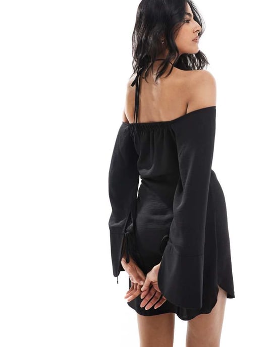 ASOS DESIGN off the shoulder halter neck mini dress with curved hem and hardware detail in black - Image 4