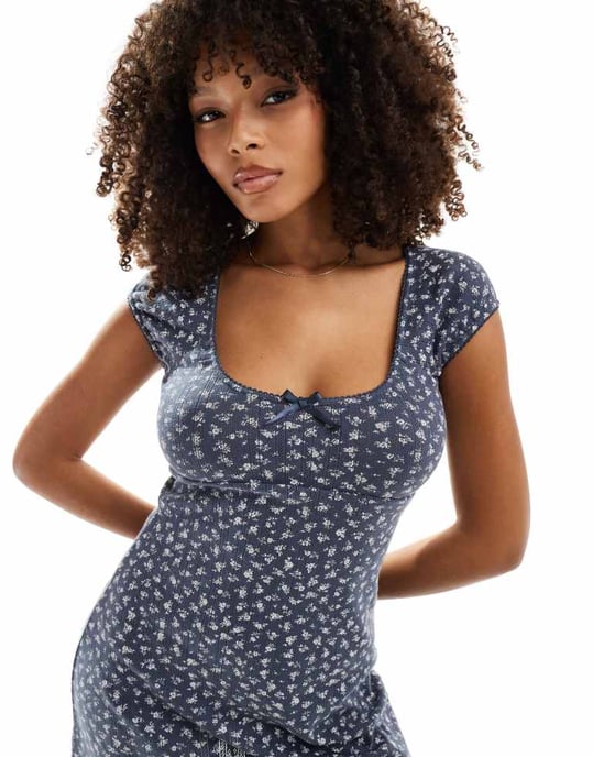 ASOS DESIGN scoop neck pointelle mini dress with bow detail in washed navy ditsy print - Image 4