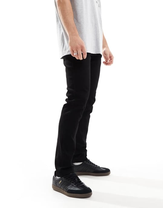Wrangler Larston slim tapered jeans i tvättad svart - Image 4