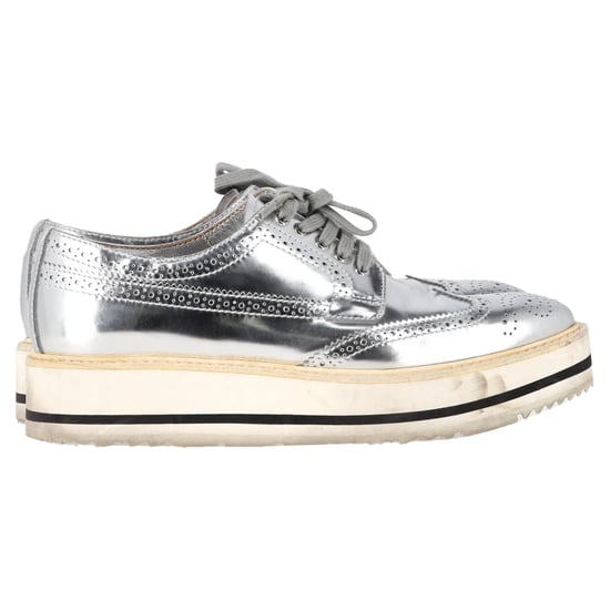 Prada Wingtip Oxford Platform Sneakers in Metallic Silver Leather - Image 1