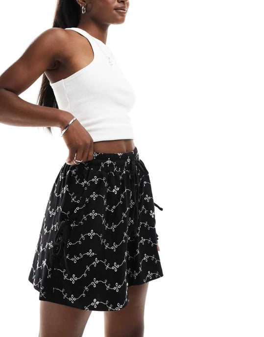 ASOS DESIGN broderie shorts with tie pockets in black/white - Image 1
