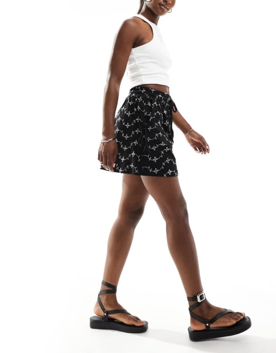 ASOS DESIGN broderie shorts with tie pockets in black/white - Image 2