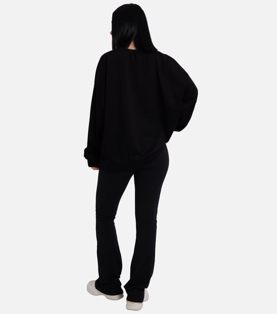 Svart jumper med rosett framtill, oversized passform - Image 4
