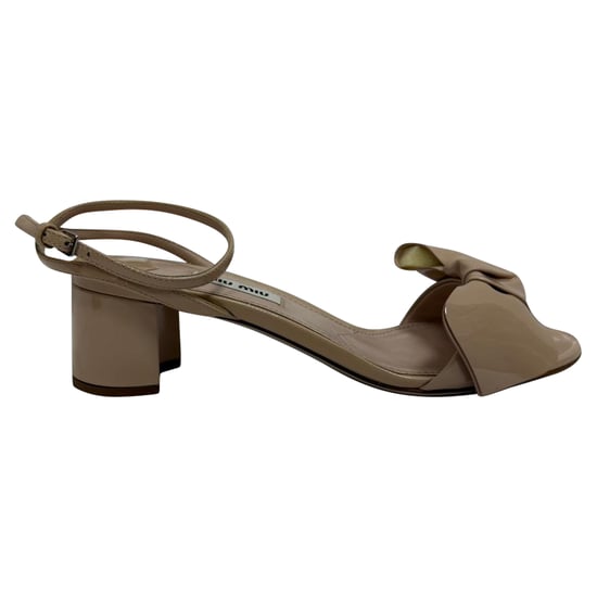 Miu Miu Bow-Embellished Ankle Strap Sandal Heels in Beige Patent Leather - Image 1