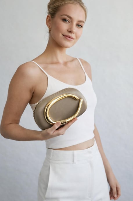 Oval Satin Hard Case Clutch Bag In Muted Gold - Image 1