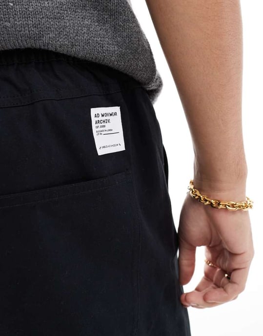 ASOS DESIGN tapered pull on trousers in black with patch - Image 3