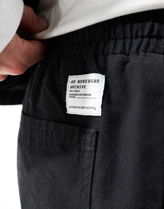 ASOS DESIGN tapered pull on trouser with back pocket patch in black - Image 2