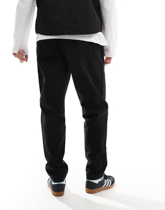 ASOS DESIGN tapered pull on trouser with back pocket patch in black - Image 3