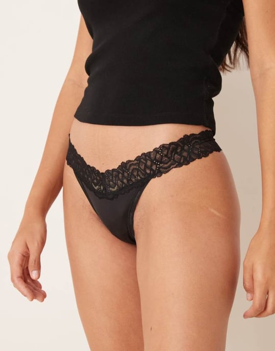 Calvin Klein Attraction lace detail thong in black - Image 1