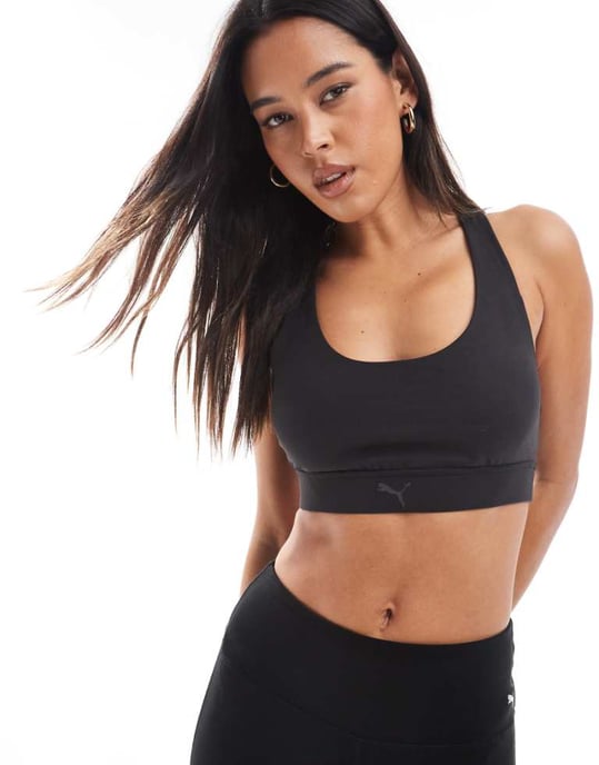 Puma Evolve Training mid impact support sports bra in black - Image 1