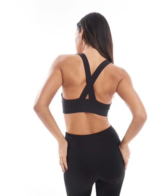 Puma Evolve Training mid impact support sports bra in black - Image 3