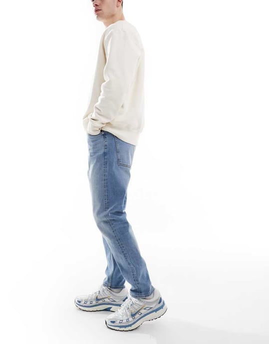 ASOS DESIGN stretch tapered jeans in light wash - Image 3