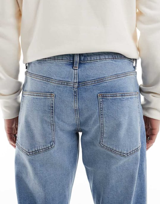 ASOS DESIGN stretch tapered jeans in light wash - Image 4