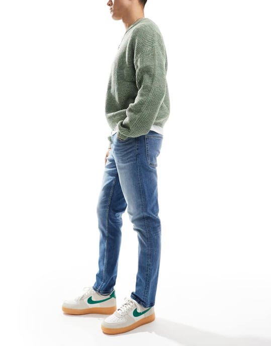 ASOS DESIGN stretch slim jeans in mid wash blue - Image 4