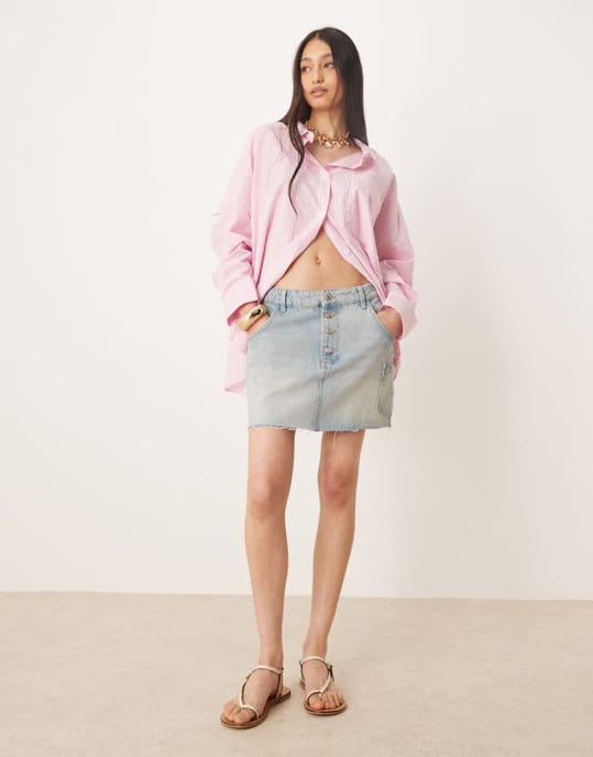 ASOS DESIGN denim mini skirt with button fly and patch pocket - Image 1