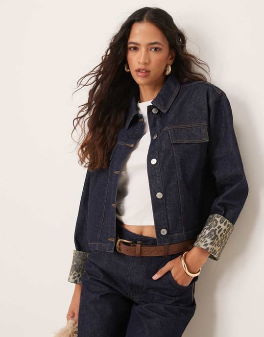 ASOS DESIGN denim jacket with leopard print turn up cuffs in indigo - Image 1