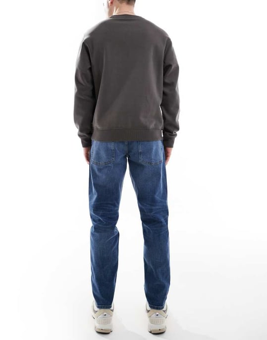 ASOS DESIGN stretch tapered jeans i medtvätt - Image 2
