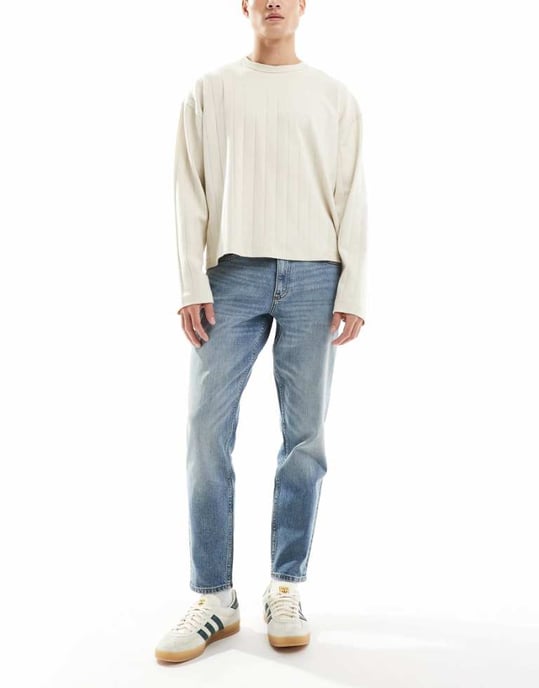 ASOS DESIGN stretch tapered jeans in mid wash blue - Image 1
