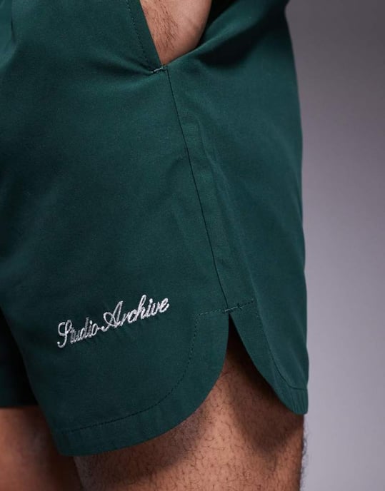 ASOS DESIGN swim shorts in mid length with embroidery in green - Image 3