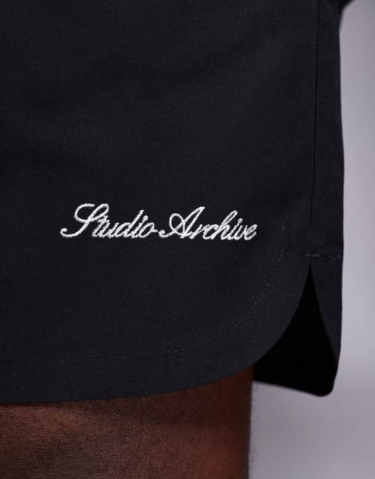 ASOS DESIGN swim shorts in mid length with embroidery placement in black - Image 3