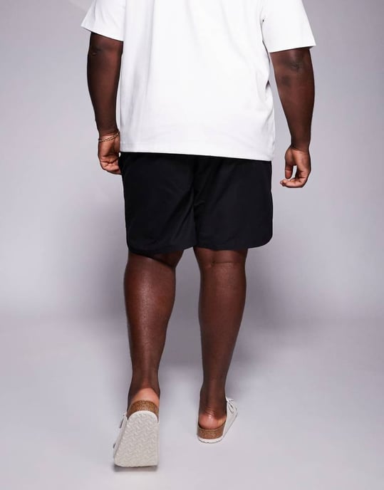 ASOS DESIGN swim shorts in mid length with embroidery placement in black - Image 4