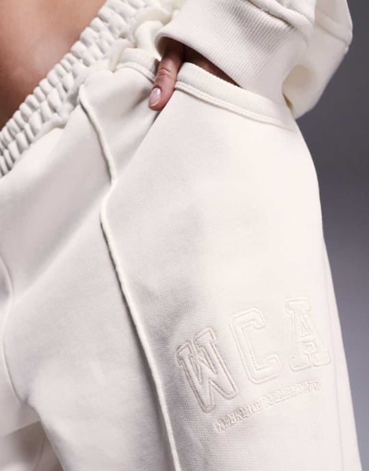 Weekend Collective co-ord wide leg seamed joggers with embroidered logo in cream - Image 3